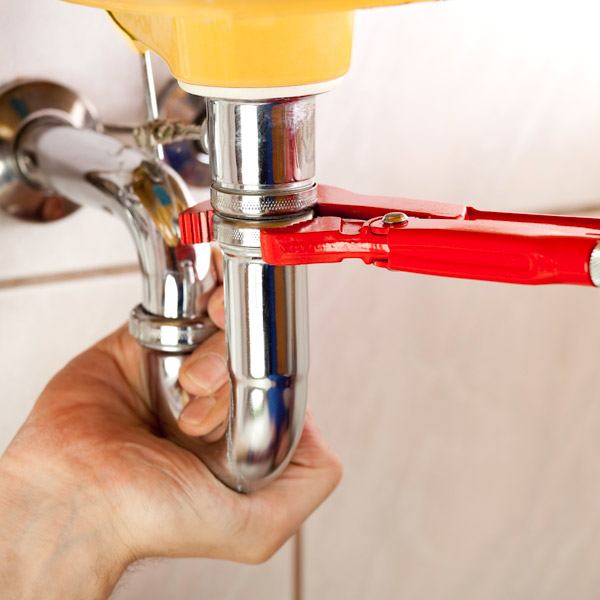 close up of kitchen sink pipes